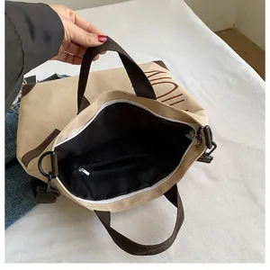 Large capacity canvas tote bag with shoulder strap, casual daily commuting handbag for women.