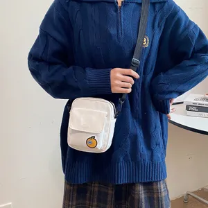 Cute Japanese style canvas crossbody bag for girls, small white shoulder bag with orange patch.