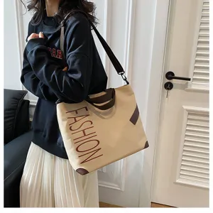 Large capacity canvas shoulder bag for women, casual versatile tote bag for daily commute.