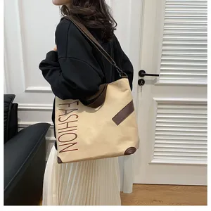 Large capacity canvas tote bag for women, casual shoulder bag with letter print for daily commute.