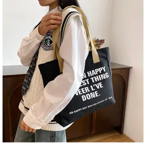Large capacity black canvas tote bag for women daily commute casual shoulder bag detailed view