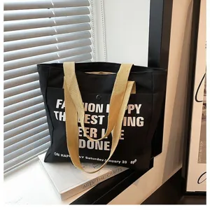Black canvas tote bag, large capacity shoulder handbag for daily commute, casual student book bag.