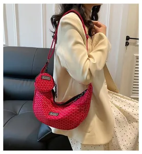 Red canvas crescent crossbody bag with small coin purse, stylish shoulder bag for women.