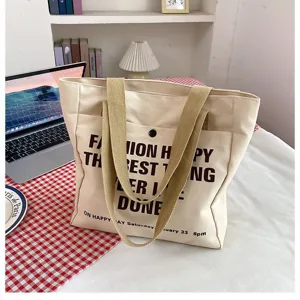 Large capacity canvas tote bag for women, casual daily commuting shoulder bag with stylish print.