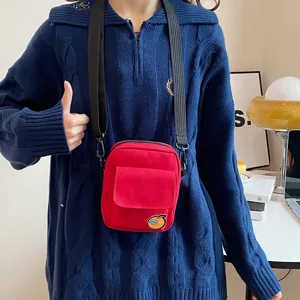 Cute canvas crossbody bag for women and kids, stylish red mobile phone shoulder bag.