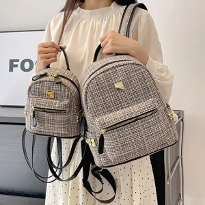 Stylish tweed backpack for women, large capacity travel school bag with chic leather trim.