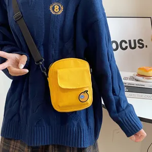 Cute Japanese style canvas crossbody bag for women, sweet small yellow phone shoulder bag.