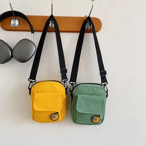 Cute canvas crossbody bag for kids and girls, small shoulder phone bag with cute orange patch.