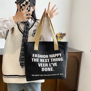 Large capacity black canvas tote bag for women, stylish letter print casual shoulder bag daily.