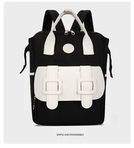 Details of the stylish black and white dual-use backpack featuring spacious front pockets.