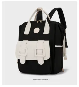 Detailed view of the black and white multifunctional backpack with dual front buckle pockets.