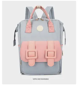 Multi-functional diaper backpack, grey and pink design, large capacity and durable baby bag.