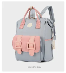 Multi-functional diaper backpack for moms, large capacity travel baby bag in gray and pink.