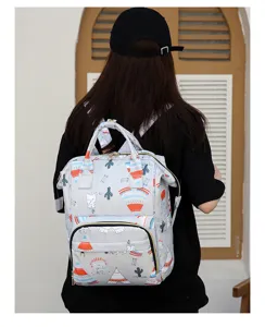 Detail view of a multi-purpose grey diaper backpack with cute pattern and large capacity.