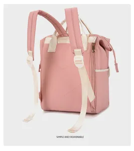 Pink multi-functional diaper backpack, large capacity travel mommy bag detail view.