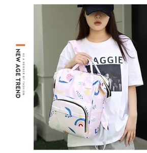 Detailed view of the multi-functional pink diaper backpack with cute abstract patterns.