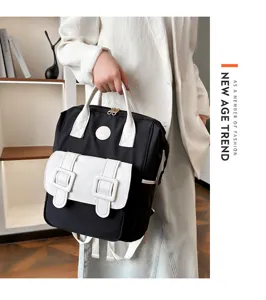Stylish black and white backpack large capacity mom travel bag with front pocket design.
