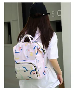 Backpack detail view showcasing vibrant colorful abstract print, durable straps, and pockets.