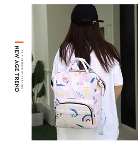 Pink multi-functional diaper backpack with cute geometric pattern for moms and daily use.