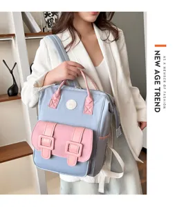 Stylish multi-functional mommy backpack with large capacity, pink and blue color block design.