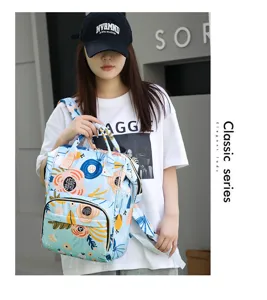 Multifunctional large capacity floral diaper backpack for moms, portable travel baby bag.