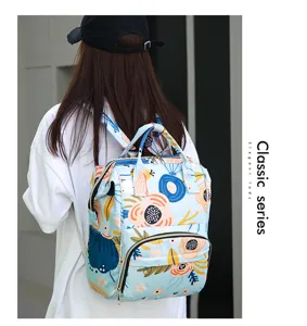 Multi-purpose floral print diaper backpack with large capacity and insulated storage pockets.