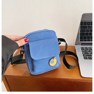Blue canvas crossbody bag with small pocket and badge, casual cute shoulder bag for women.