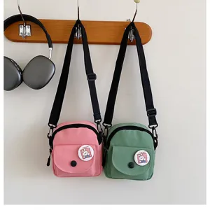Sac bandoulière en toile style coréen INS pour femmes, badge lapin mignon, sac d'étudiant.