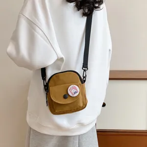 Petit sac bandoulière en toile pour femme, sac marron avec poche avant mignonne.