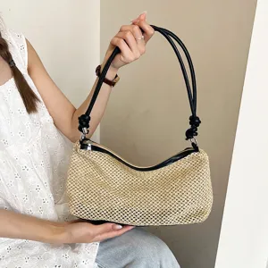 Stylish woven straw shoulder bag for women, casual summer beach tote handbag style.