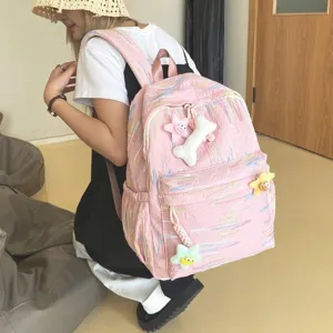 Sac à dos rose style ins pour filles, cartable étudiant mignon avec pendentifs en peluche.