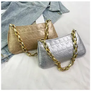 Metallic skull embossed baguette shoulder bag with chunky gold chain for women chic style