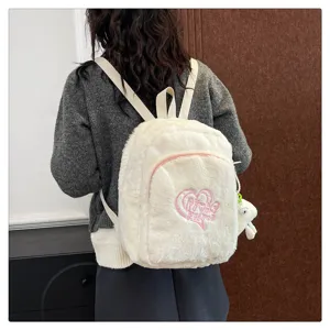 Japanese style plush backpack for women, cute white fuzzy school bag with heart embroidery.