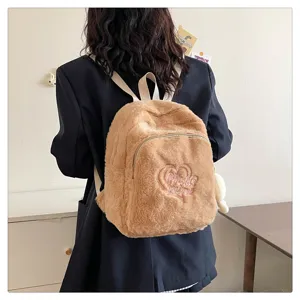 Cute fluffy plush backpack for women, casual soft faux fur school bag with heart embroidery.