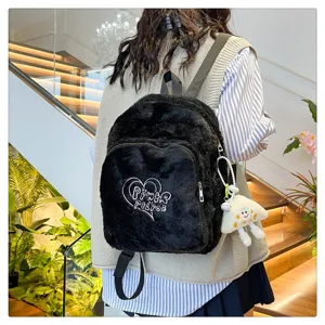 Black fuzzy plush backpack detail view, featuring soft textured fabric and casual daily school style.