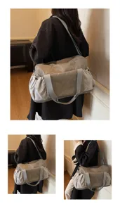Close-up details displaying the large capacity grey travel gym bag with side pockets and shoulder strap.