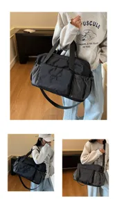 Detailed view of the multi-functional travel duffel bag showing wearing effect for gym and trips.