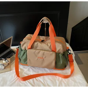 Detailed view of a stylish travel fitness duffel bag with dry-wet separation and vibrant straps.