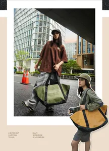 Outdoor travel tote bag detail showing durable fabric, sturdy webbing straps, and large capacity.