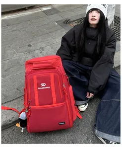 Outdoor travel backpack detail showing large capacity, durable red fabric, and multi-pocket design.