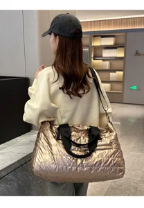 Shiny gold quilted travel duffel bag for women, lightweight short trip luggage gym bag.