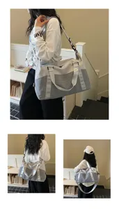 Modische graue und weiße Reisetasche mit Schultergurt für Pendeln, Fitness und Kurztrips ideal.