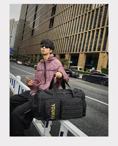 Detailed shot of black multi-functional sports travel duffel bag for fitness and outdoor use.