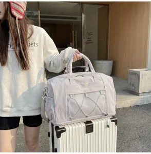 Detailed view of large capacity travel duffel bag with mesh pocket for gym and business trip