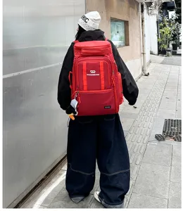Large capacity red travel backpack, durable outdoor sports mountaineering fitness luggage bag.