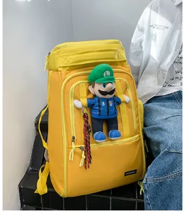 Large capacity travel backpack with cute doll pendant, wear-resistant outdoor sports bag.