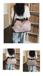 Detailed view of fashionable color-block travel duffel bag with adjustable shoulder strap.