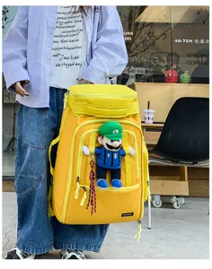 Large capacity travel backpack with luggage strap and cute doll for outdoor sports commute.
