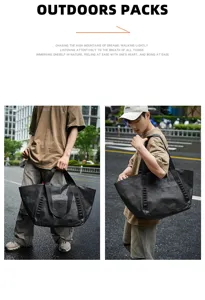 Outdoor travel bag detail showcasing durable black textured fabric and sturdy webbing handles.