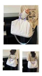 Large capacity travel duffel bag with adjustable strap, perfect for short trips and gym use.